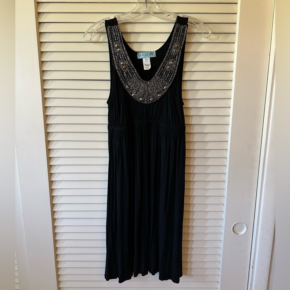 Dress with embellished neckline